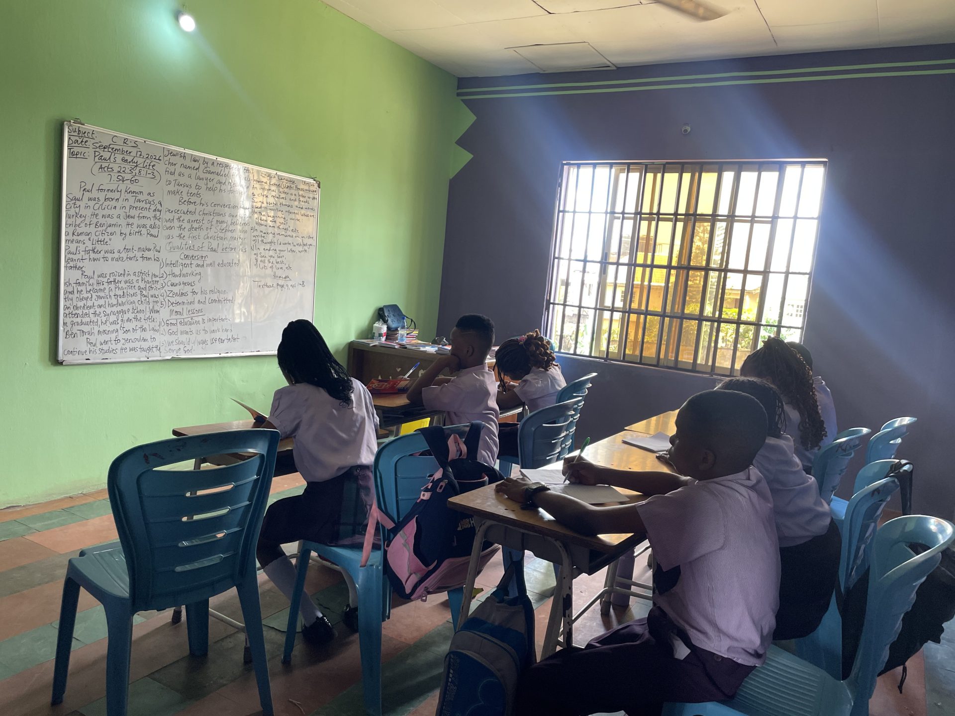 Pupils following a lesson from the whiteboard at Royal Excellentia International School